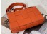 Bottega Veneta Cassette Bag In Orange Intreccio Lambskin