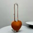 Alaia Le Coeur Crossbody Bag in Brown Calfskin